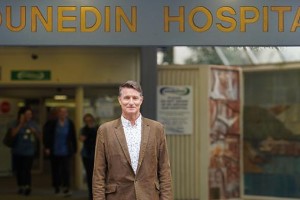 Richard Egan in front of hospital