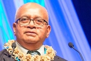 Sione speaking at conference crop