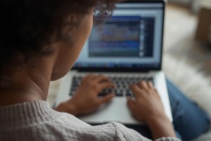 person on a laptop from the back